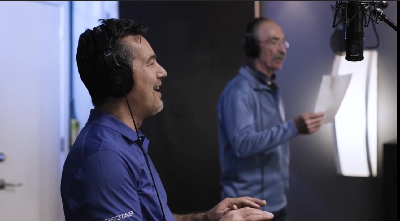 Two Geotab employees singing